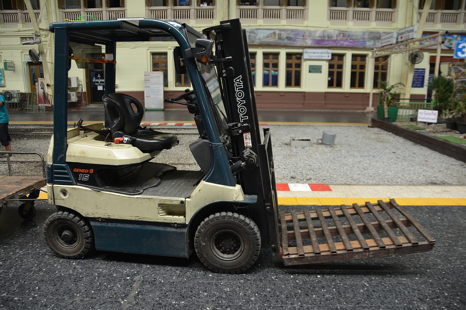 Creamed color Forklift outside